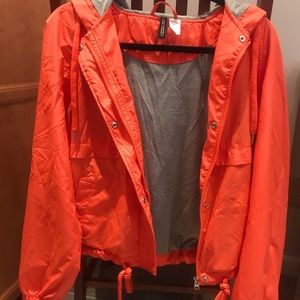 Bright orange windbreaker